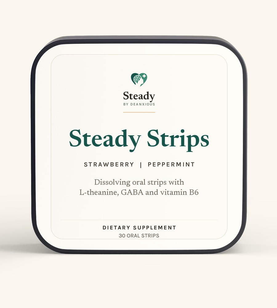 Steady Strips: a rounded black tin with a cream Steady label on its face, photographed straight on against a warm cream ground.